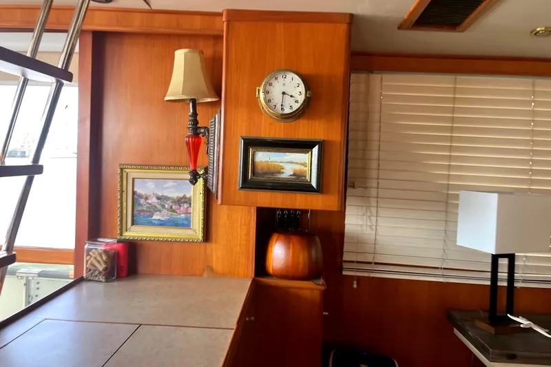 Slide: The Image of Interior of 1999 Jefferson Marquessa 56 yacht with paintings, clock, and lamp. - 44