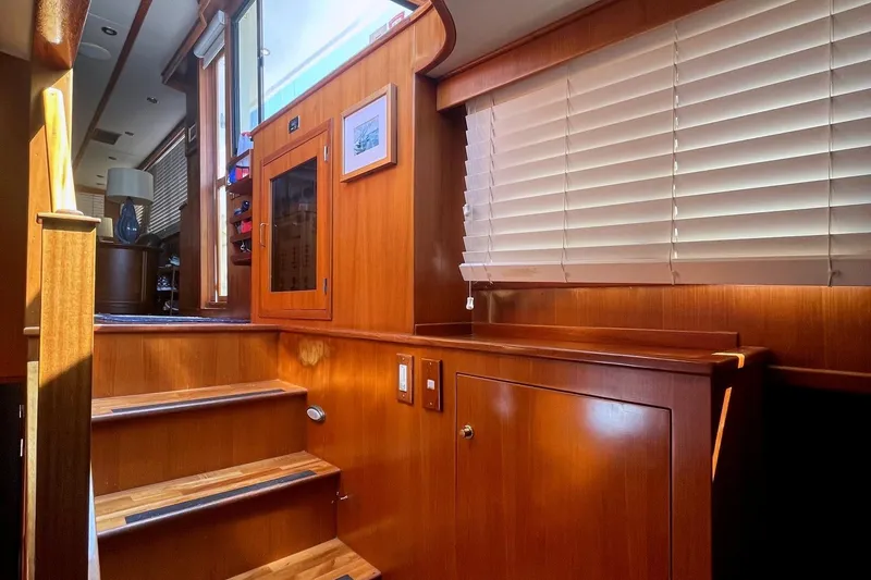 Slide: The Image of Interior of 1999 Jefferson Marquessa 56 yacht with wooden stairs and cabinetry. - 47