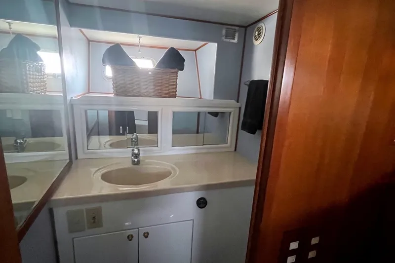 Slide: The Image of Bathroom interior of 1999 Jefferson Marquessa 56 yacht with sink and mirror. - 51