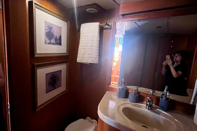 Slide: The Image of Bathroom interior of 1999 Jefferson Marquessa 56 yacht with mirror and framed artwork. - 53