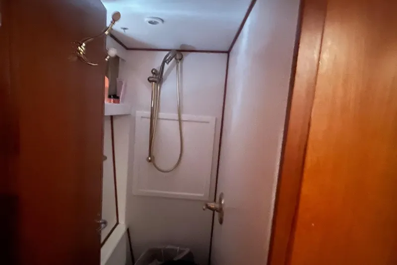 Slide: The Image of Bathroom interior of 1999 Jefferson Marquessa 56 yacht with shower and wooden door. - 54