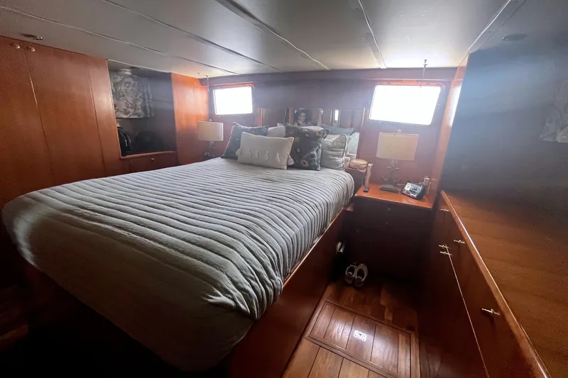 Slide: The Image of Cozy bedroom interior of 1999 Jefferson Marquessa 56 yacht with wooden furnishings. - 58