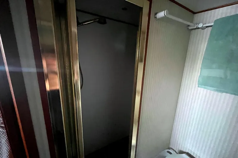Slide: The Image of Bathroom interior of 1999 Jefferson Marquessa 56 yacht with shower and towel rack. - 62
