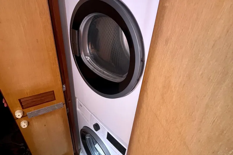 Slide: The Image of Stacked washer and dryer inside a 1999 Jefferson Marquessa 56 yacht. - 67