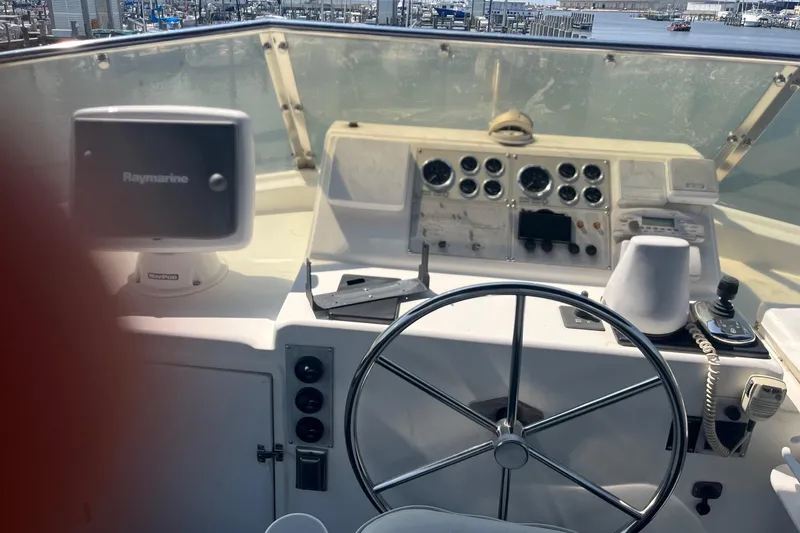 Slide: The Image of Helm of 1999 Jefferson Marquessa 56 yacht with navigation equipment and steering wheel. - 9