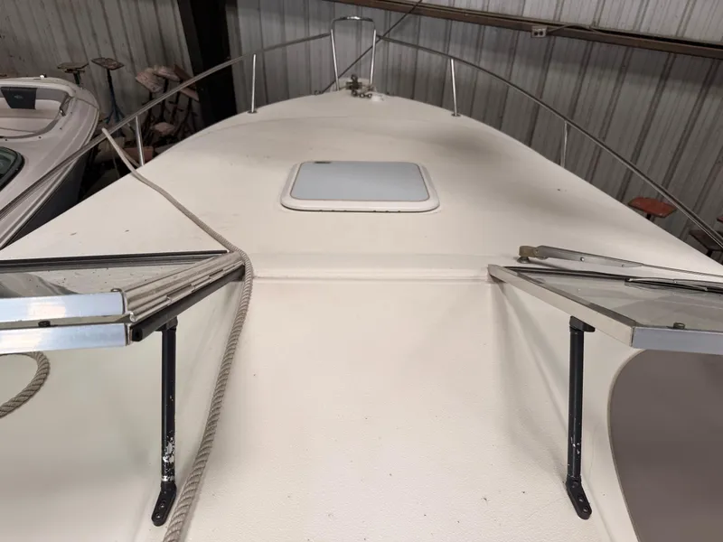 Slide: The Image of 2001 Wellcraft 2600 Martinique boat deck with open hatch in storage. - 14