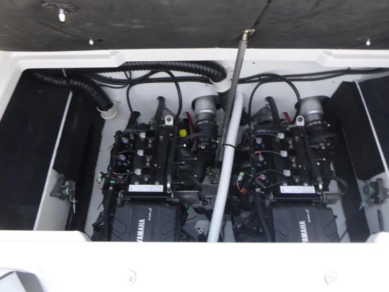 Slide: The Image of 2025 Yamaha Boats AR220 engine compartment showcasing dual engines. - 14
