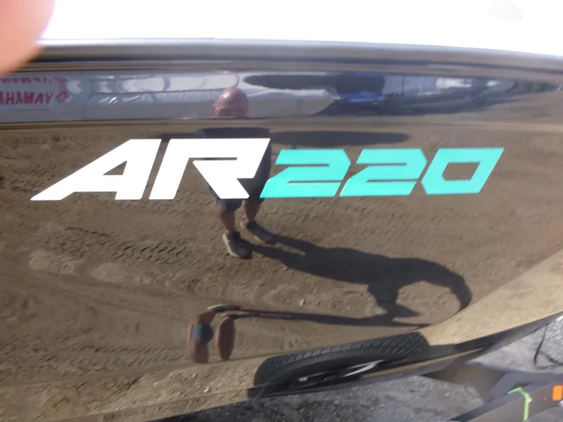 Slide: The Image of 2025 Yamaha Boats AR220 logo on sleek black hull. - 15