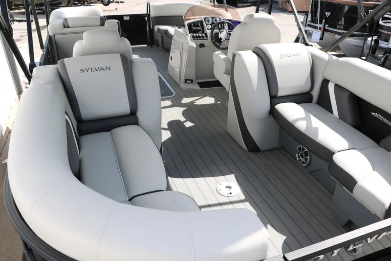 Slide: The Image of 2025 Sylvan Mirage X3 pontoon boat interior with luxurious seating and modern dashboard. - 16