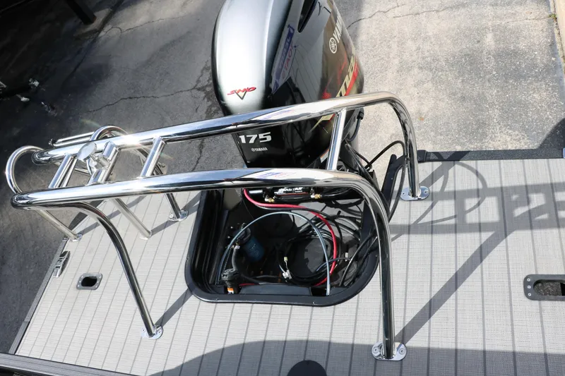 Slide: The Image of 2025 Sylvan Mirage X3 boat with 175 horsepower engine and sleek chrome railing. - 21