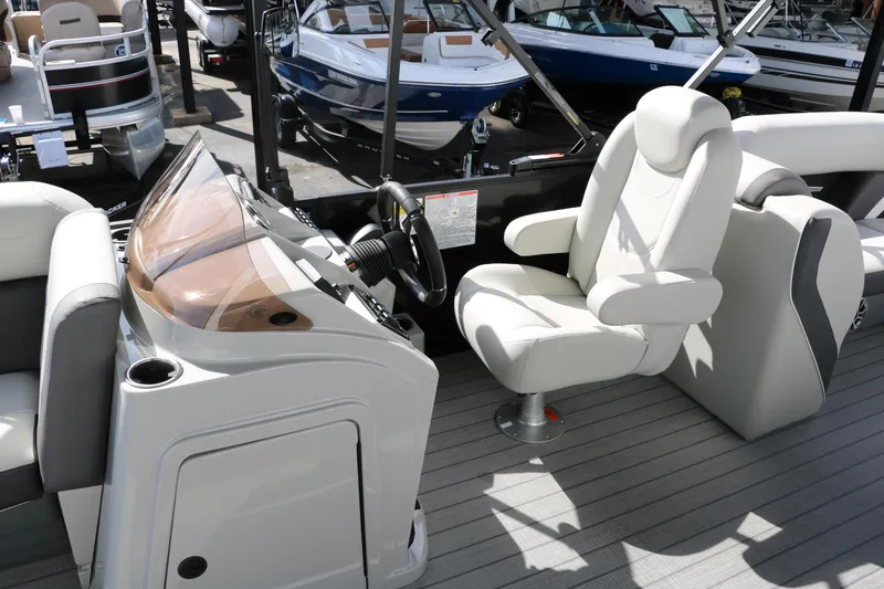 Slide: The Image of 2025 Sylvan Mirage X3 boat interior with modern helm and comfortable seating. - 28