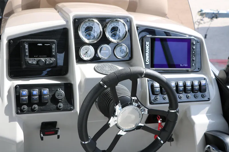Slide: The Image of 2025 Sylvan Mirage X3 dashboard with steering wheel, gauges, and navigation system. - 31