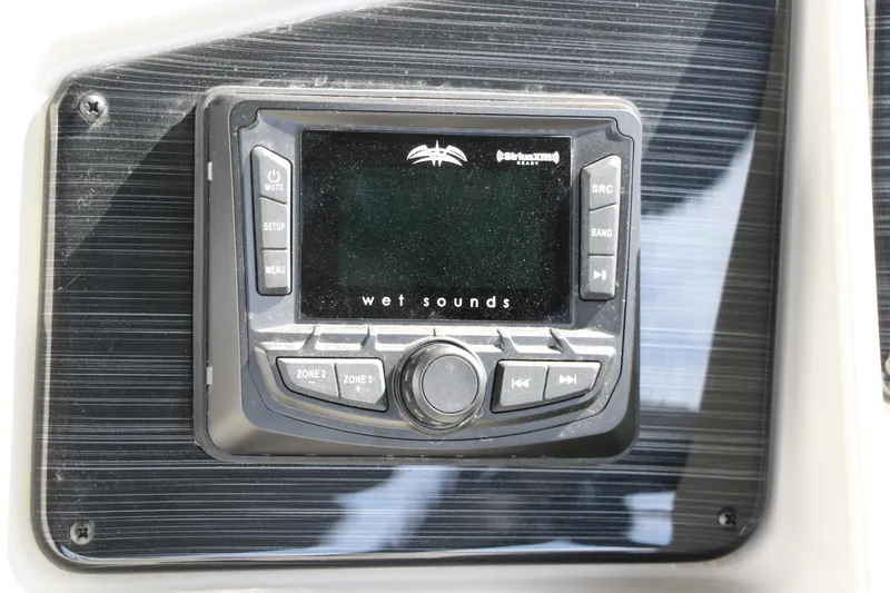 Slide: The Image of Wet Sounds audio system on 2025 Sylvan Mirage X3 boat dashboard. - 32