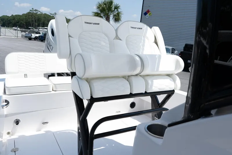 Slide: The Image of 2026 Twin Vee 22 Baycat boat with white cushioned seating and sleek design. - 17