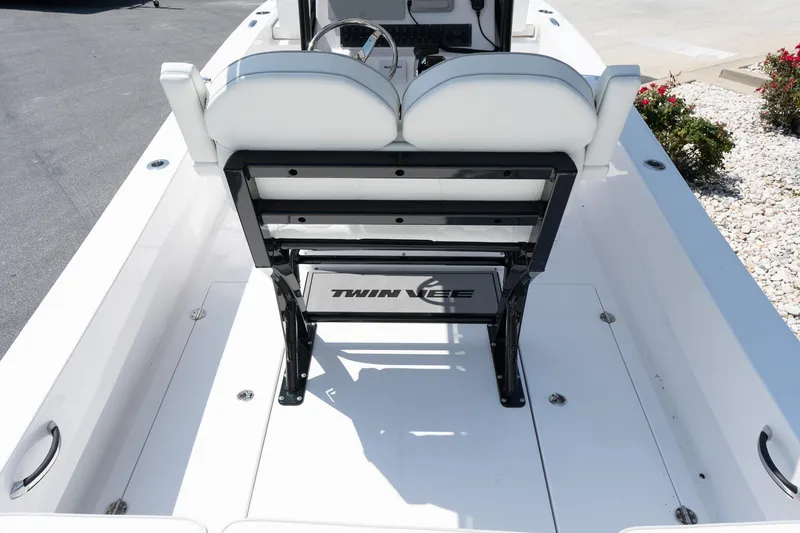 Slide: The Image of 2026 Twin Vee 22 Baycat boat interior with white seating and sleek design. - 27