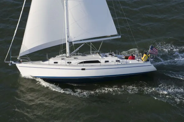 Slide: The Image of Sailing yacht Catalina 446, 2026 model, cruising on open water with full sails. - 0