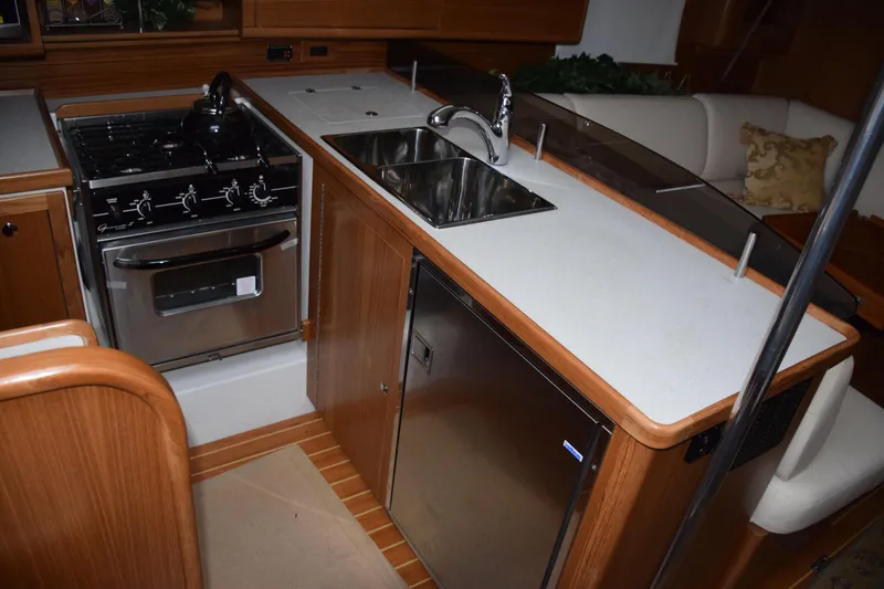 Slide: The Image of Modern kitchen in 2026 Catalina 446 yacht with stove, sink, and fridge. - 11
