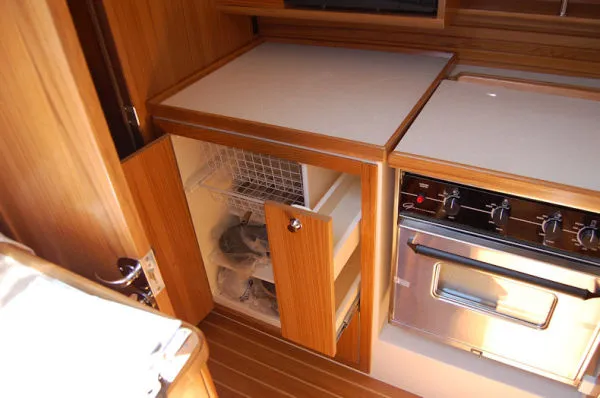 Slide: The Image of Modern kitchen in 2026 Catalina 446 yacht with oven and storage. - 12