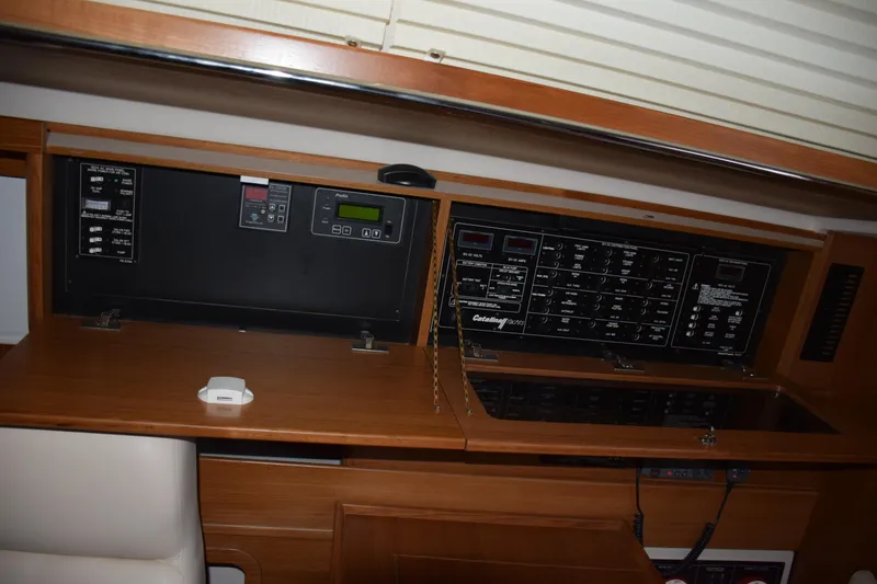 Slide: The Image of Control panel of a 2026 Catalina 446 yacht, featuring navigation and electrical systems. - 17