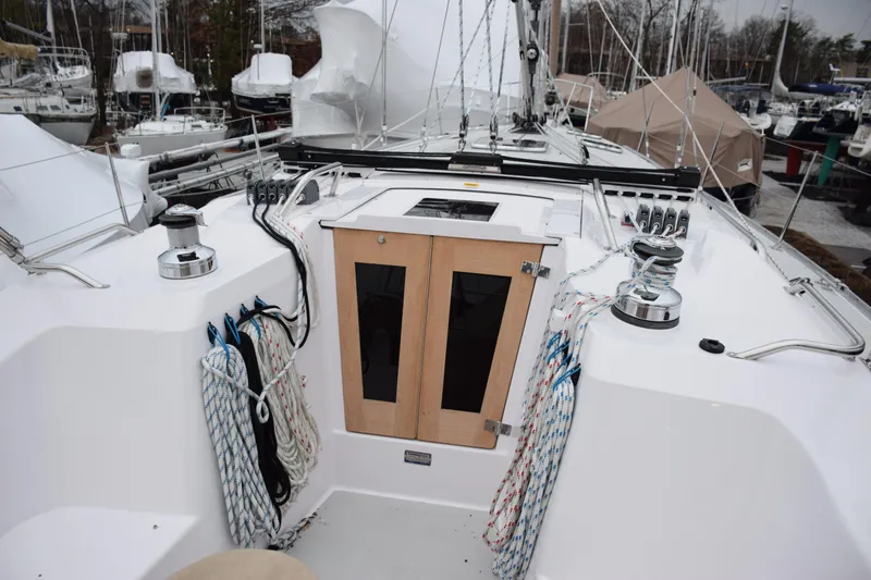 Slide: The Image of Sailboat cockpit of 2026 Catalina 446 with ropes and winches, docked in a marina. - 22