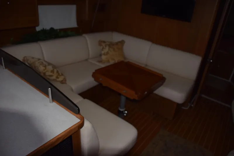 Slide: The Image of Luxurious interior of 2026 Catalina 446 yacht with cozy seating and wooden table. - 3