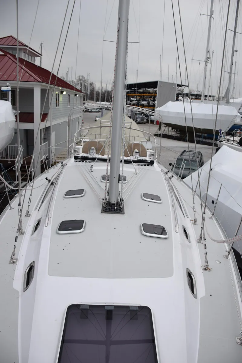 Slide: The Image of 2026 Catalina 446 sailboat docked, showcasing sleek deck design and modern features. - 34