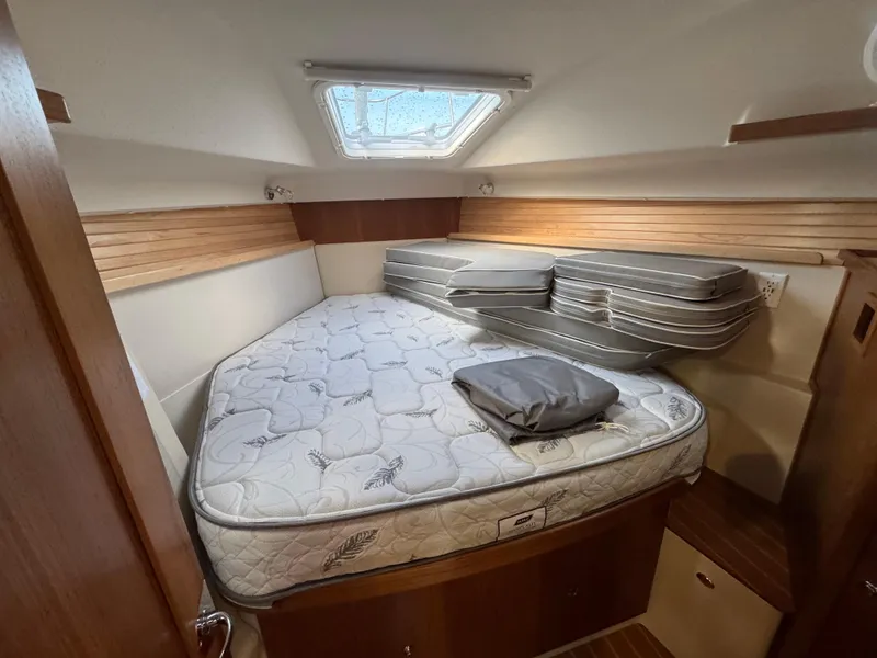 Slide: The Image of Cozy cabin interior of 2026 Catalina 356 sailboat with mattress and cushions. - 29
