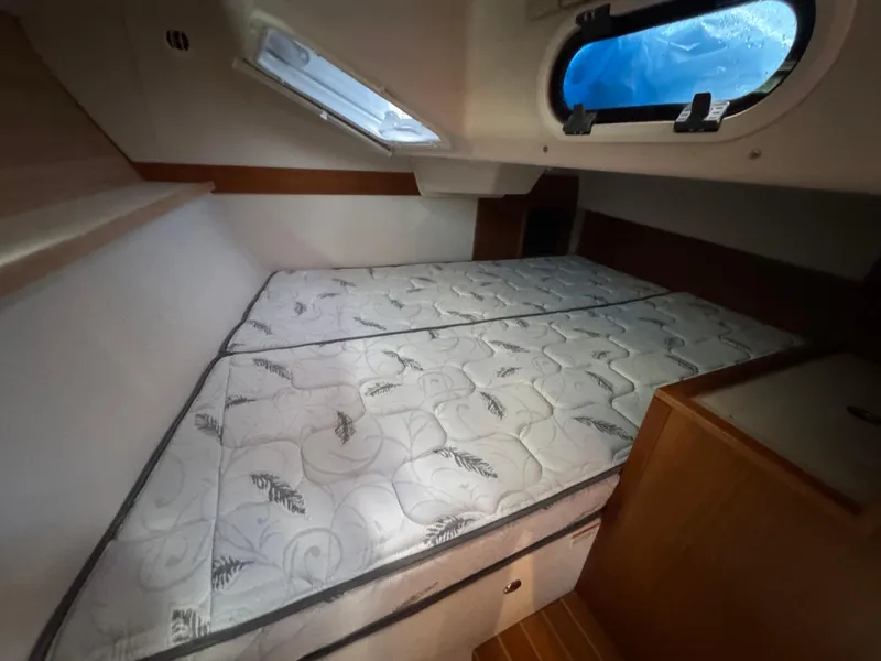 Slide: The Image of Interior cabin of 2026 Catalina 356 yacht with a comfortable bed and porthole window. - 30