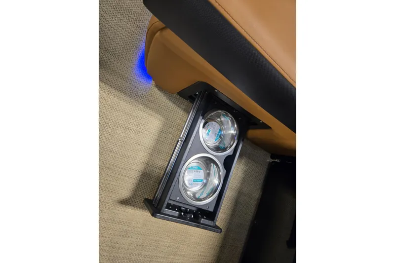 Slide: The Image of Cup holders with blue LED lighting in 2025 Princecraft Vogue 25 RL boat interior. - 11