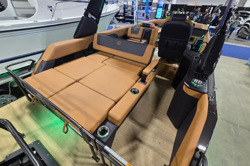 Slide: The Image of 2025 Princecraft Vogue 25 RL boat interior with luxurious tan seating and modern design. - 15