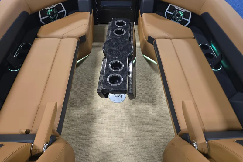 Slide: The Image of Luxurious interior of 2025 Princecraft Vogue 25 RL boat with tan seating and sleek table. - 20