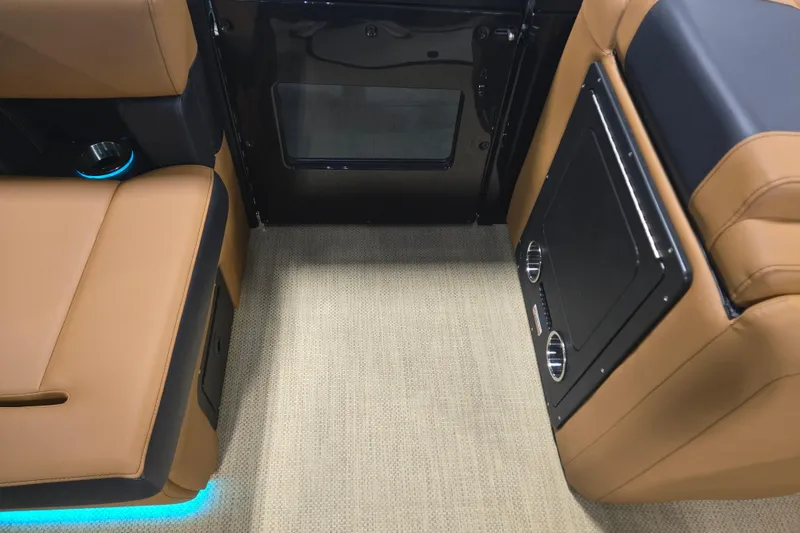 Slide: The Image of Luxurious interior of 2025 Princecraft Vogue 25 RL boat with tan seating and LED lighting. - 9