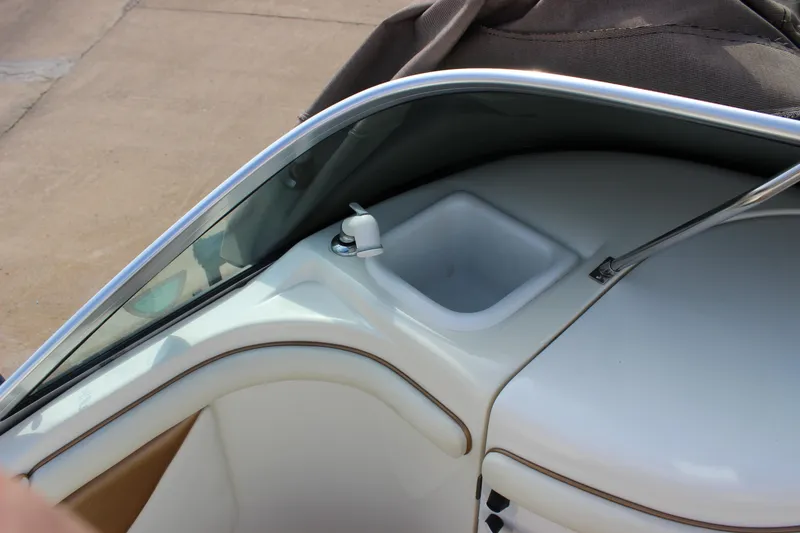 Slide: The Image of 1998 Sea Ray 210 Sundeck interior detail with sink and windshield. - 14