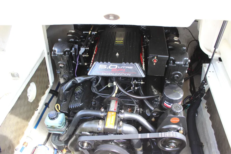 Slide: The Image of Engine compartment of a 1998 Sea Ray 210 Sundeck boat, featuring a 5.0L V8 engine. - 20