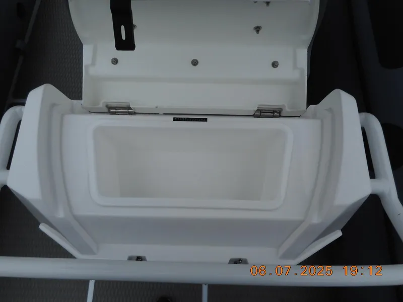 Slide: The Image of Open storage compartment on a 2025 Highfield Patrol 540 boat. - 8