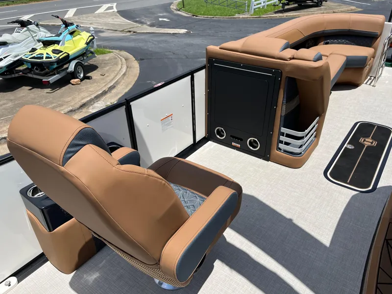 Slide: The Image of Luxurious interior of 2026 Harris Grand Mariner 250 pontoon boat with tan seating. - 10