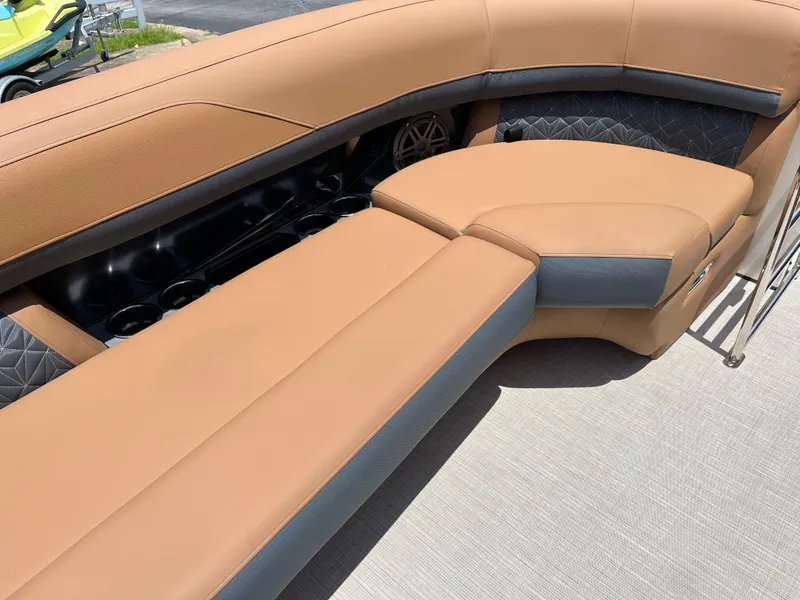 Slide: The Image of Luxurious seating on 2026 Harris Grand Mariner 250 boat, featuring tan and gray upholstery. - 12