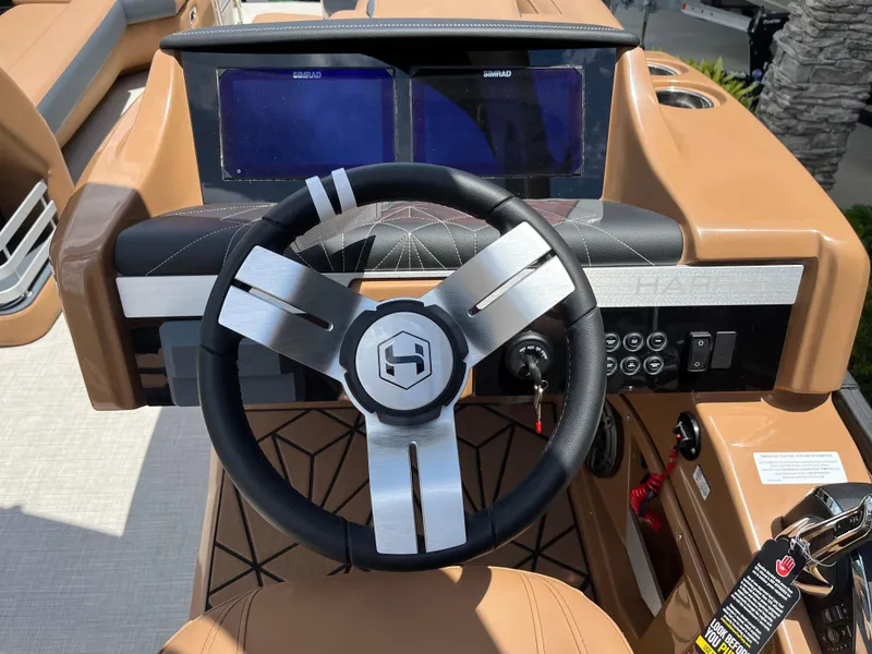 Slide: The Image of Steering wheel and dashboard of 2026 Harris Grand Mariner 250 boat. - 6