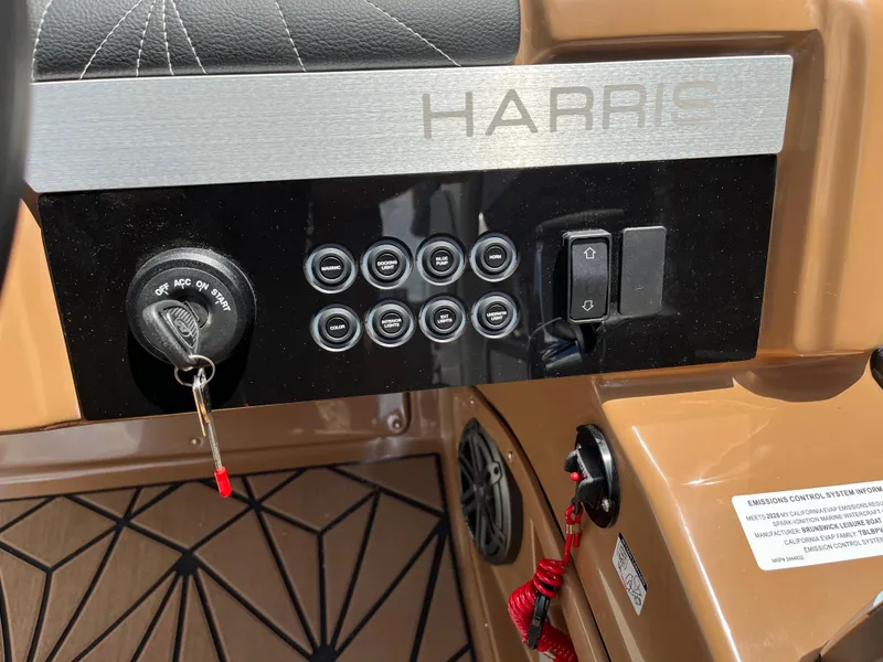 Slide: The Image of Control panel of 2026 Harris Grand Mariner 250 boat with ignition and switches. - 7