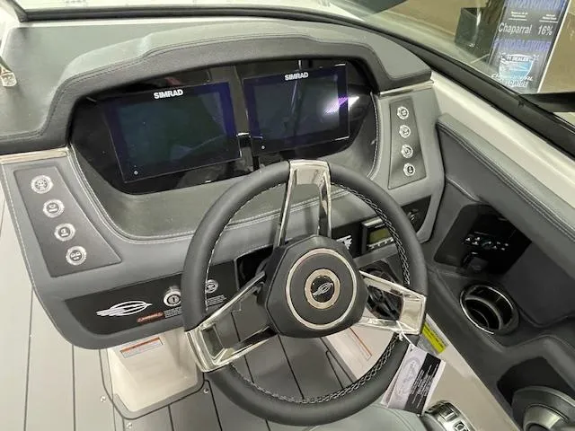 Slide: The Image of 2025 Chaparral 247 SSX boat interior with gray seating and modern design. - 10
