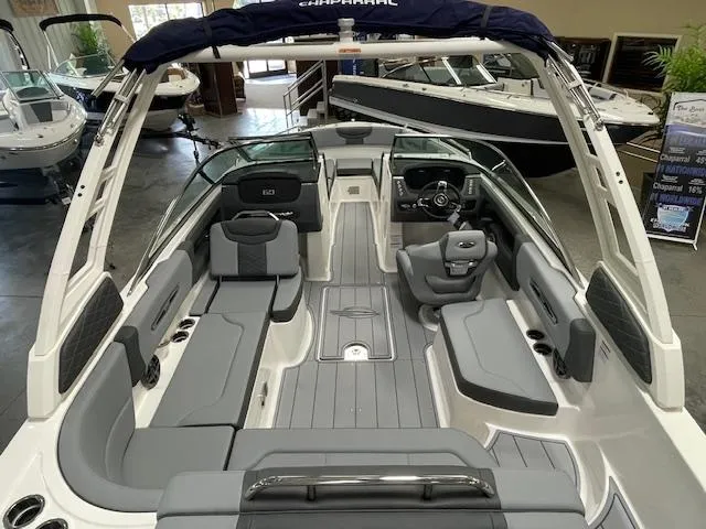 Slide: The Image of 2025 Chaparral 247 SSX boat interior with gray seating and modern design. - 13