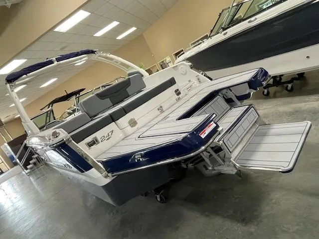 Slide: The Image of 2025 Chaparral 247 SSX boat displayed indoors, featuring sleek design and modern features. - 3
