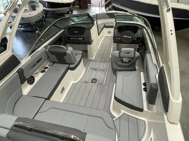 Slide: The Image of 2025 Chaparral 247 SSX boat with extended swim platform in showroom. - 4