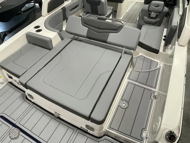Slide: The Image of 2025 Chaparral 247 SSX boat interior with sleek gray seating and modern dashboard. - 5