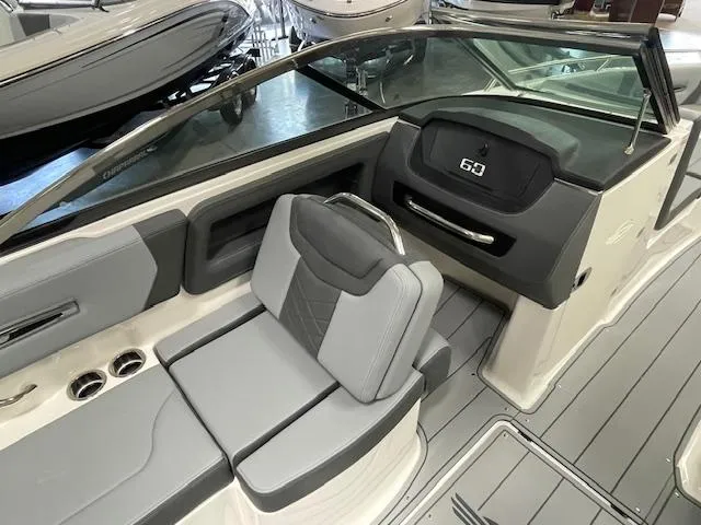 Slide: The Image of 2025 Chaparral 247 SSX boat interior with sleek seating and modern dashboard design. - 8