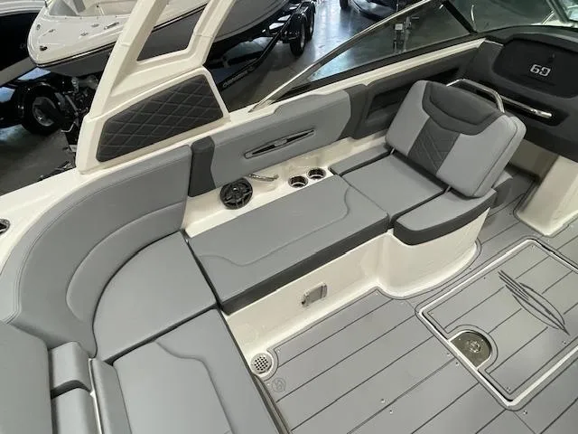 Slide: The Image of 2025 Chaparral 247 SSX boat interior with gray seating and modern dashboard. - 9