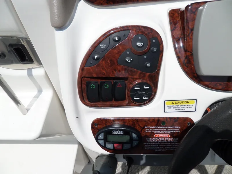Slide: The Image of Control panel of a 2005 Sea Ray 290 SS boat with woodgrain finish. - 20