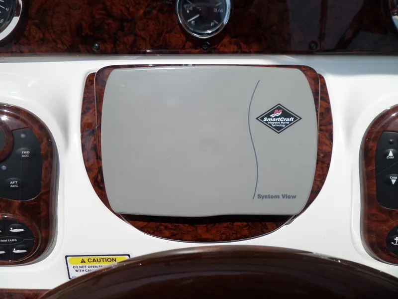 Slide: The Image of SmartCraft System View on 2005 Sea Ray 290 SS dashboard, featuring wood grain accents. - 21