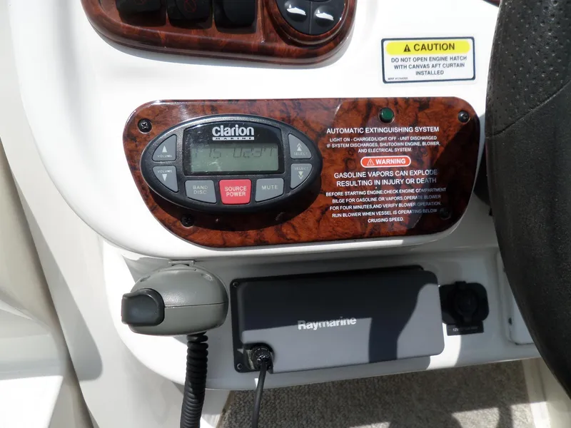 Slide: The Image of Control panel of a 2005 Sea Ray 290 SS boat with Clarion audio system. - 24
