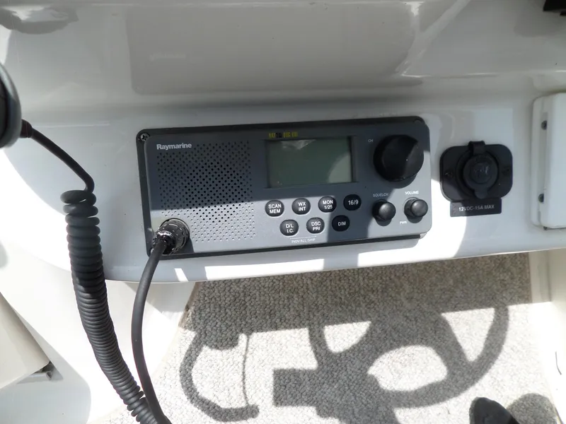 Slide: The Image of Control panel of a 2005 Sea Ray 290 SS boat with Raymarine radio system. - 25